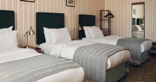 Habitación Triple del hotel The Columbia. Foto 1