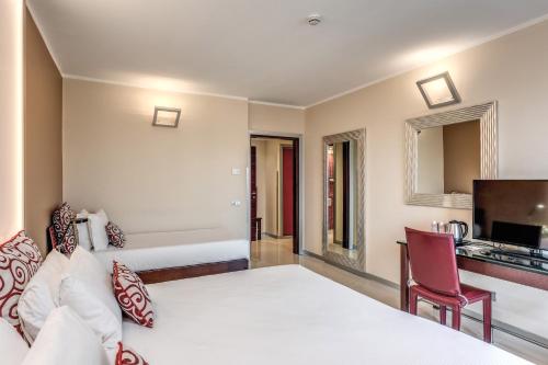 Habitación Triple del hotel La Griffe. Foto 7