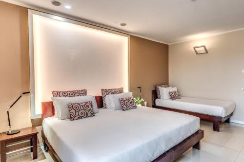 Habitación Triple del hotel La Griffe. Foto 9