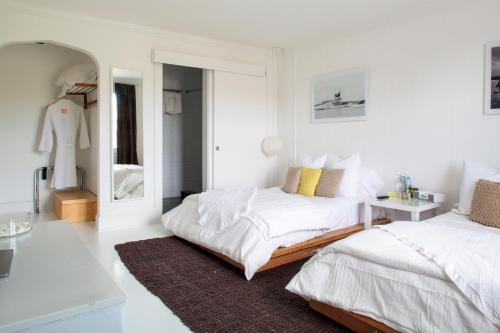 Habitación doble con 2 camas dobles y vistas al jardín del hotel Sole East Resort. Foto 2