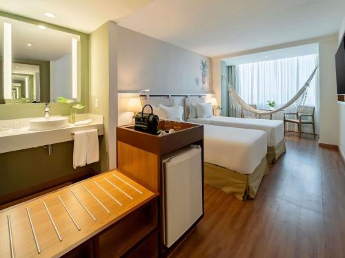 Habitación Doble Premium Executive con vistas al mar - 2 camas individuales del hotel Grand Mercure Rio De Janeiro Copacabana. Foto 1