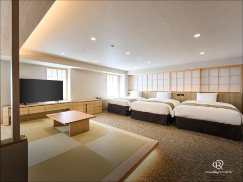 Habitación Cuádruple del hotel Daiwa Roynet Ginza Premier. Foto 4