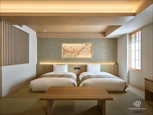 Habitación Cuádruple del hotel Daiwa Roynet Ginza Premier. Foto 5