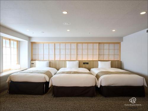 Habitación Cuádruple del hotel Daiwa Roynet Ginza Premier. Foto 6