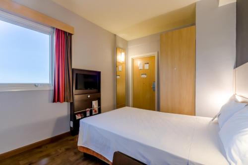 Habitación Doble Estándar del hotel Ibis Barretos. Foto 14
