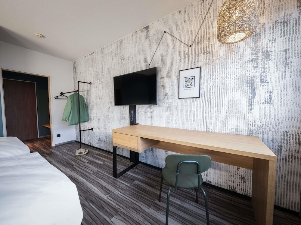 Habitación estándar con 2 cómodas camas individuales del hotel Ibis Styles Linz