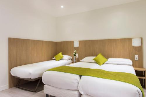 Habitación Triple del hotel Bel Oranger Gare de Lyon. Foto 2