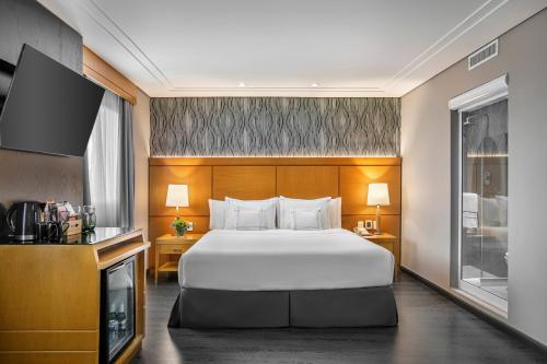 Habitación Premium con cama extragrande del hotel Melia Jardim Europa. Foto 1