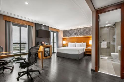 Alojamiento Premium con balcón - Cama extragrande del hotel Melia Jardim Europa