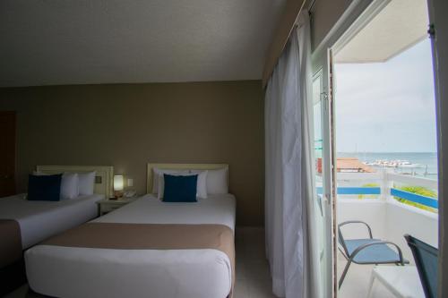 Habitación Doble con vistas al mar del hotel Ocean View Cancun Arenas. Foto 1