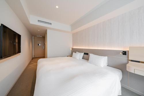 Habitación con cama extragrande. del hotel Keio Prelia Kyoto Karasuma Gojo. Foto 7
