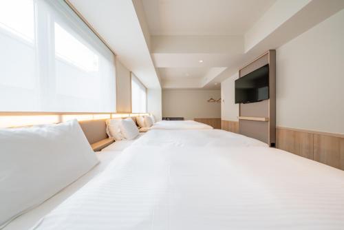 Habitación Cuádruple del hotel Keio Prelia Kyoto Karasuma Gojo. Foto 9
