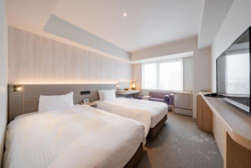 2 habitaciones dobles con 2 camas, son contiguas, no comunicadas del hotel Keio Prelia Kyoto Karasuma Gojo. Foto 5