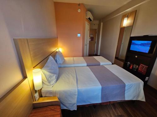 Habitación Standard con 2 camas individuales del hotel Ibis Mossoró. Foto 3
