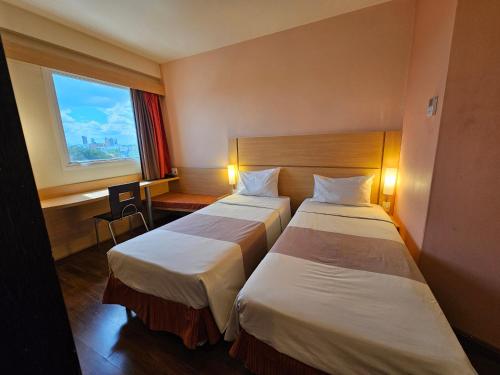 Habitación Standard con 2 camas individuales del hotel Ibis Mossoró. Foto 4