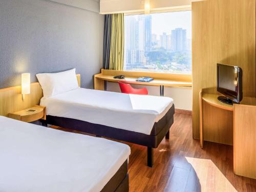 Habitación Doble Estándar - 2 camas del hotel ibis Guarulhos Aeroporto. Foto 6