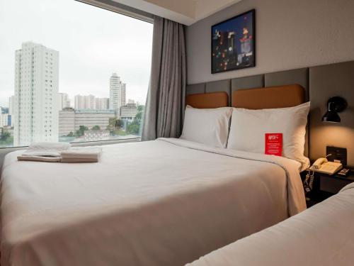 Habitación Cuádruple del hotel ibis Guarulhos Aeroporto. Foto 4