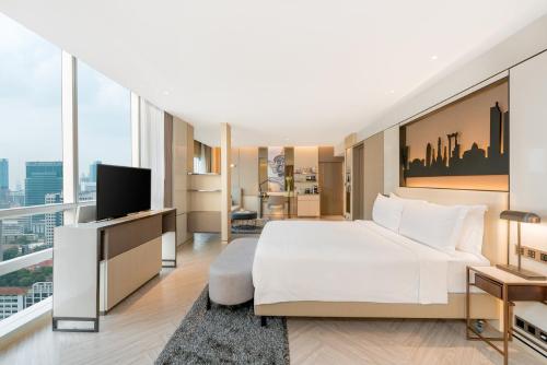 Suite Pathumwan con cama extragrande del hotel Pathumwan Princess