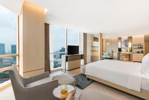 Suite Pathumwan con cama extragrande del hotel Pathumwan Princess. Foto 1