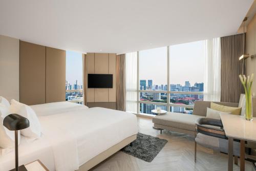 Habitación Grand Deluxe esquinera - 2 camas del hotel Pathumwan Princess. Foto 3