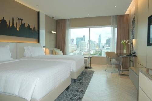 Habitación Grand Deluxe - 2 camas del hotel Pathumwan Princess. Foto 3