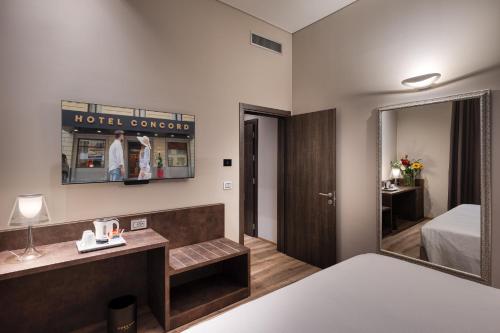 Habitación Deluxe con 2 camas grandes del hotel Concord. Foto 1