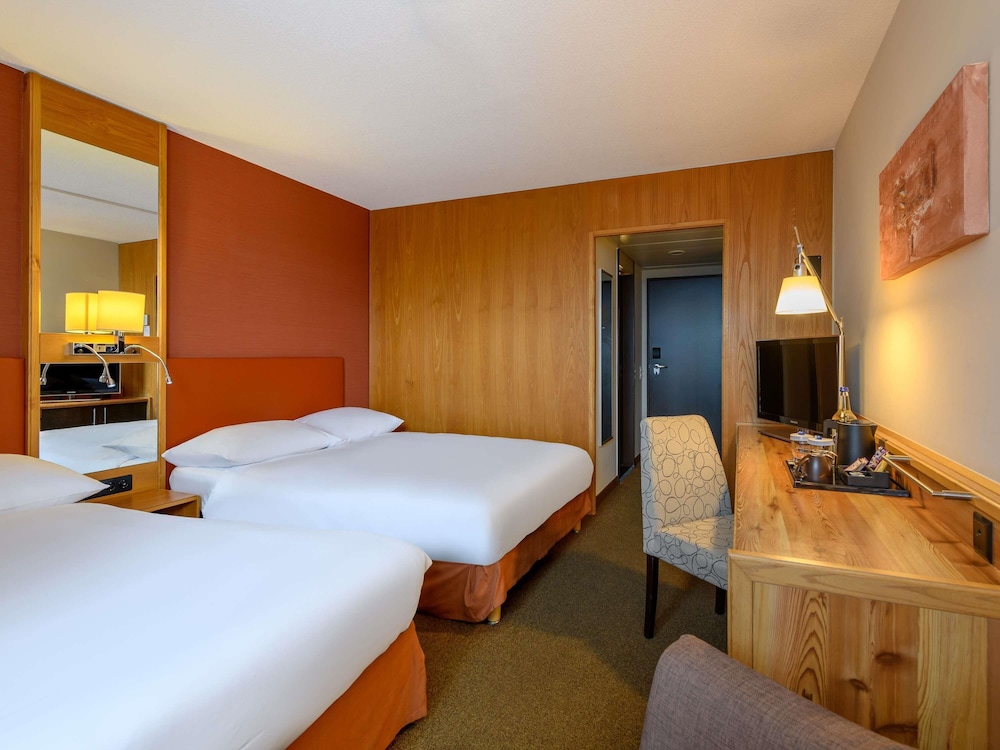 Habitación clásica, 2 camas de matrimonio del hotel Mövenpick Egerkingen