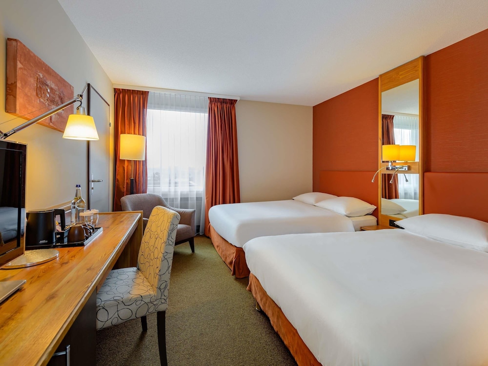 Habitación clásica, 2 camas de matrimonio del hotel Mövenpick Egerkingen. Foto 1