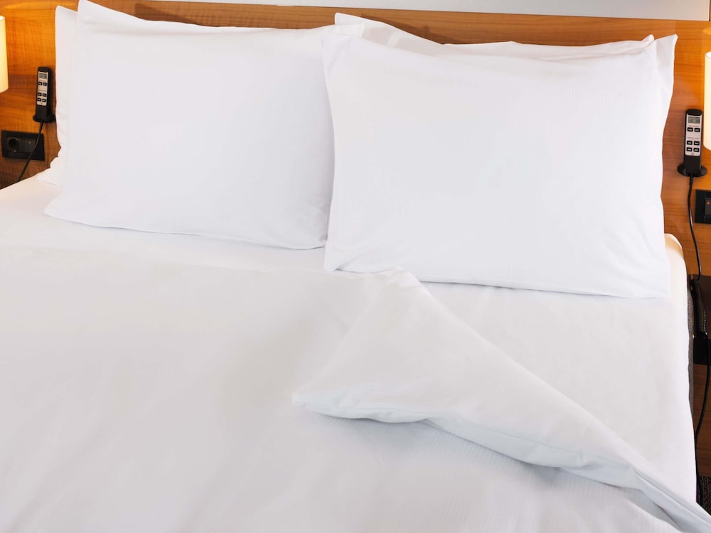 Habitación clásica, 2 camas de matrimonio del hotel Mövenpick Egerkingen. Foto 2