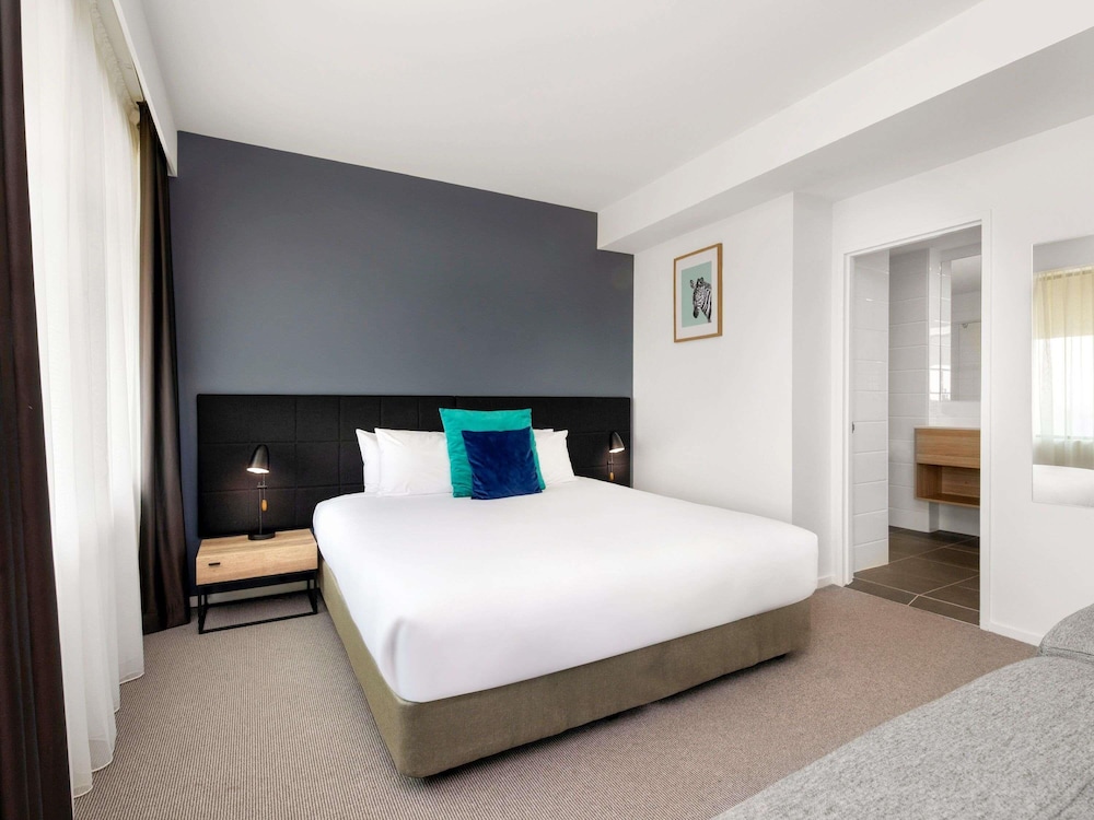 Suite Deluxe con 1 cama King o 2 camas individuales del hotel Mantra Macarthur. Foto 6