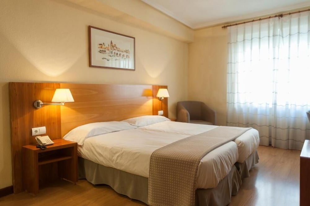 Habitación con 1 cama doble o 2 individuales del hotel Mercado by gaiarooms. Foto 3