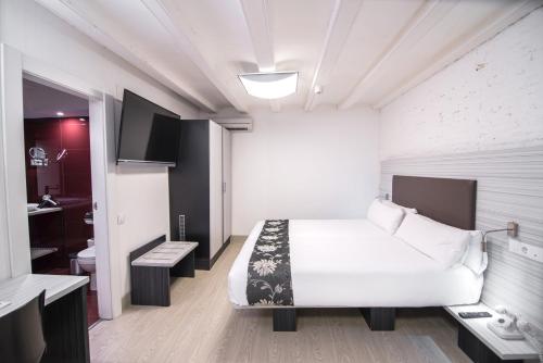 Apartamento Sofá Cama incluido 2 Camas individuales 1 Cama doble del hotel Petit Palace Boquería Garden. Foto 4