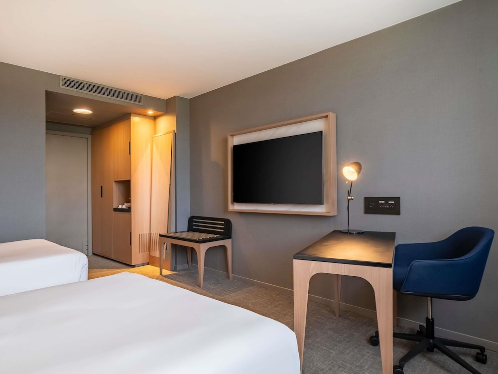 Habitación Deluxe, 2 camas individuales, planta alta del hotel Pullman São Paulo Guarulhos Airport. Foto 2