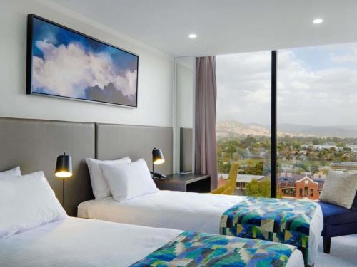 Estudio con 2 camas individuales del hotel Mantra Albury. Foto 1