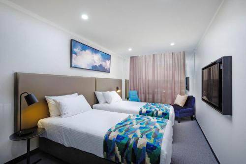 Estudio con 2 camas individuales del hotel Mantra Albury. Foto 6
