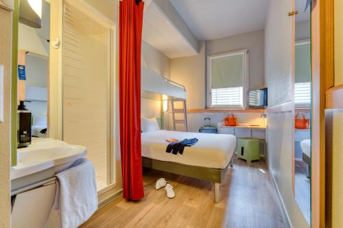 Habitación Triple del hotel Ibis Budget Luzern City. Foto 7