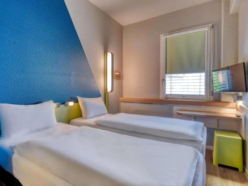 Habitación Doble Estándar - 2 camas del hotel Ibis Budget Luzern City. Foto 2