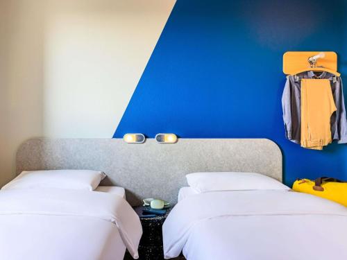 TWIN - habitación con dos camas individuales, 90 x 200 cm. del hotel Ibis Budget Lausanne Bussigny. Foto 1