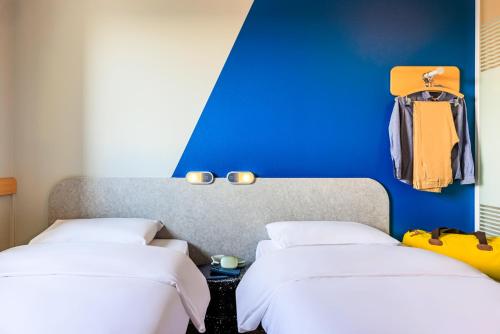 TWIN - habitación con dos camas individuales, 90 x 200 cm. del hotel Ibis Budget Lausanne Bussigny. Foto 5