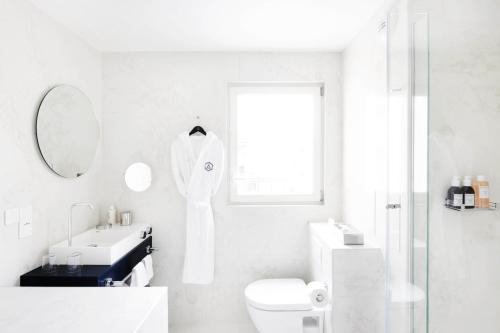 Habitación Triple Deluxe del hotel Perpetual Elysée Montaigne