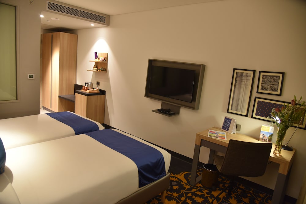 Habitación Deluxe Twin del hotel Grand Mercure Mysore. Foto 3