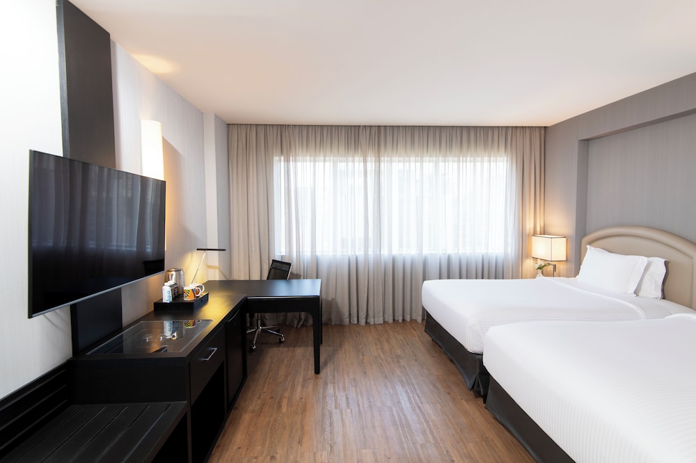 Habitación Deluxe con 2 camas individuales, 2 camas individuales, bañera del hotel Pullman São Paulo Vila Olímpia. Foto 1