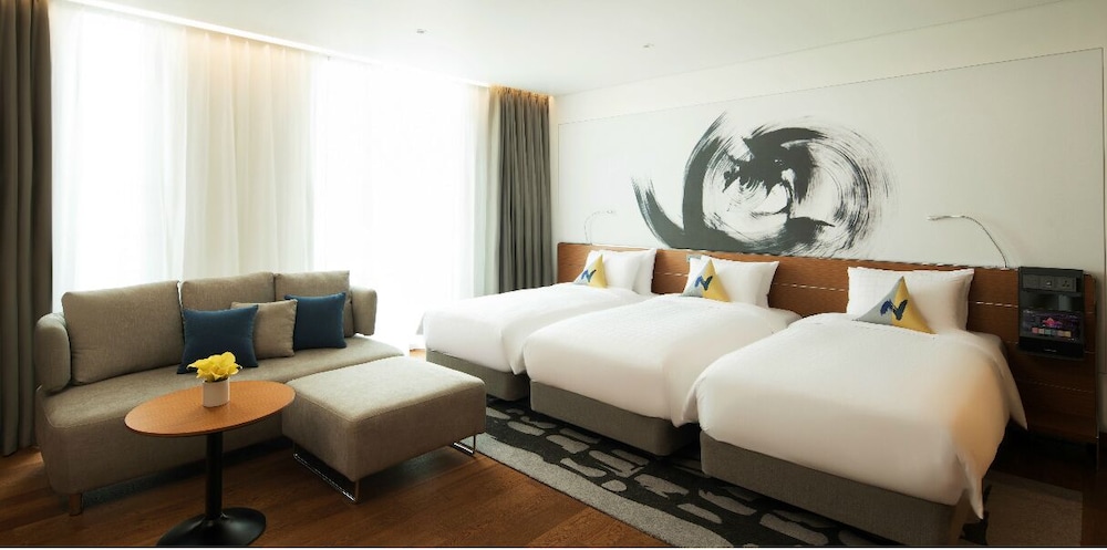 Residencia Deluxe 1 Dormitorio - 3 camas individuales del hotel Novotel Ambassador Seoul Dongdaemun Hotels and Residences. Foto 1