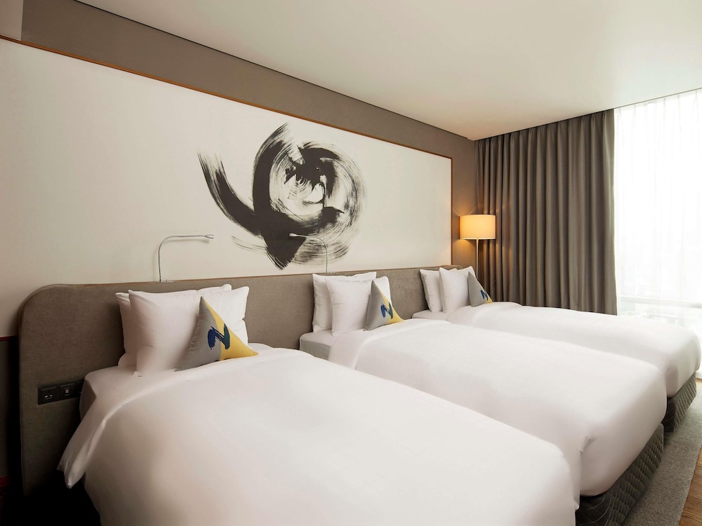 Habitación Superior - 3 camas individuales del hotel Novotel Ambassador Seoul Dongdaemun Hotels and Residences. Foto 1