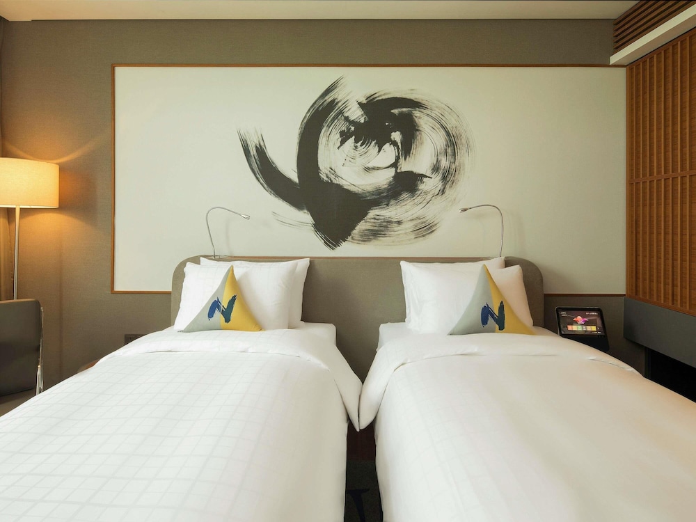 Habitación Ejecutiva - 2 camas individuales del hotel Novotel Ambassador Seoul Dongdaemun Hotels and Residences. Foto 1