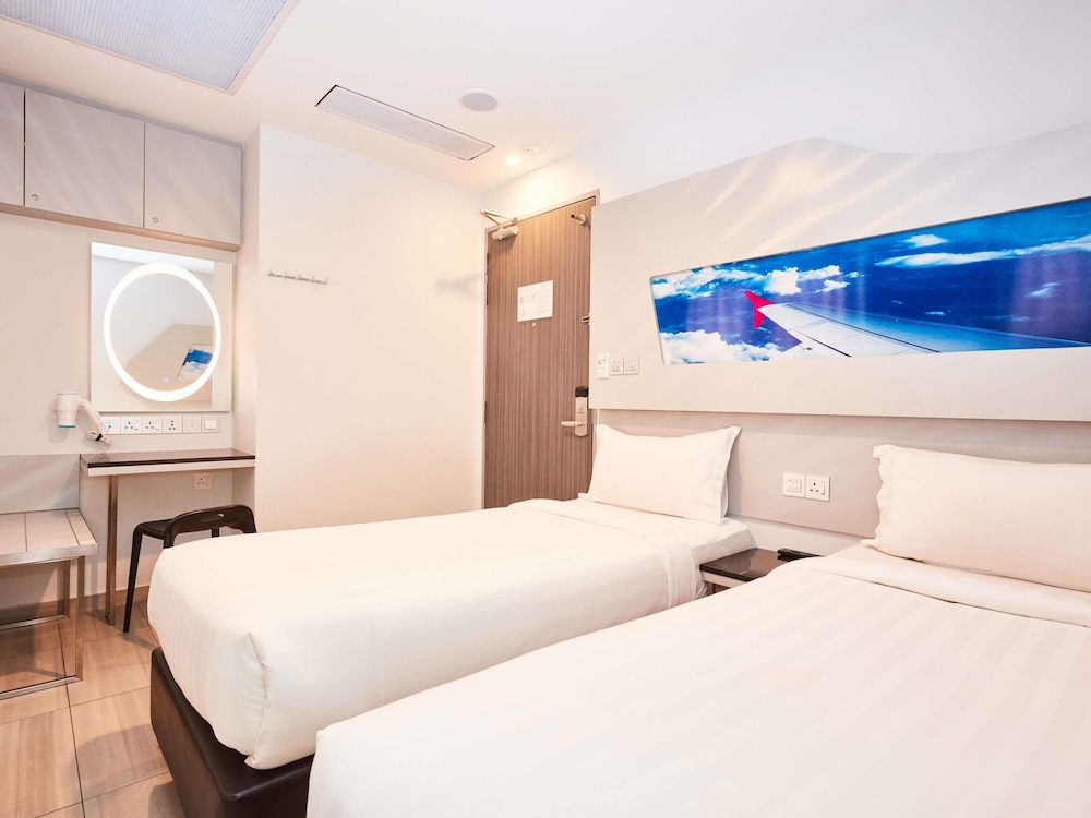 Cabaña con 2 camas individuales del hotel Ibis Budget Singapore Selegie. Foto 6
