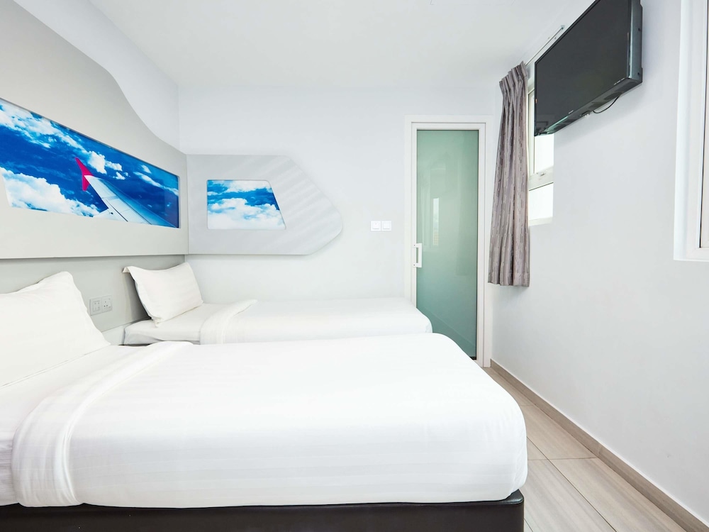Cabaña con 2 camas individuales del hotel Ibis Budget Singapore Selegie. Foto 6