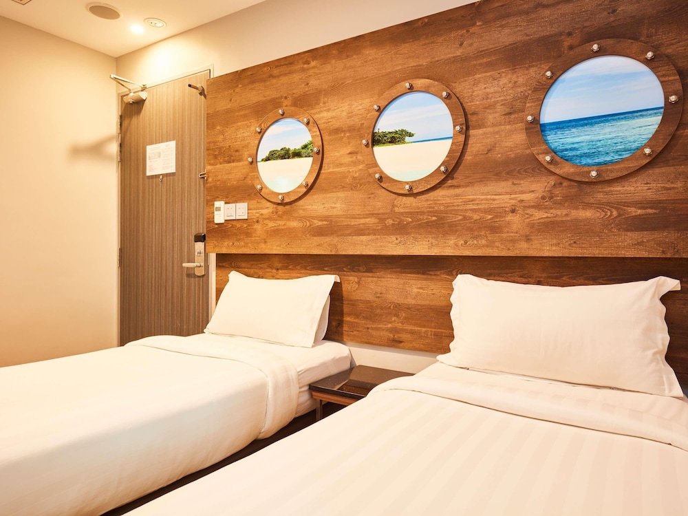 Cabaña con 2 camas individuales del hotel Ibis Budget Singapore Selegie. Foto 9