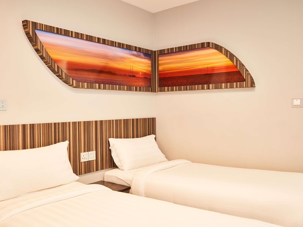 Cabaña con 2 camas individuales del hotel Ibis Budget Singapore Selegie. Foto 10