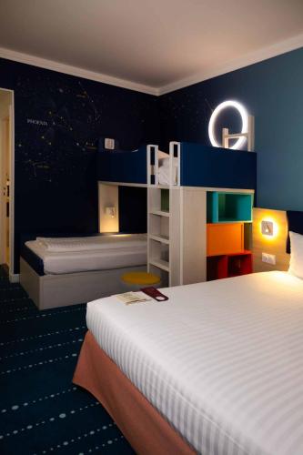 Habitación Familiar del hotel Grand Magic Hotel Marne La Vallée. Foto 4